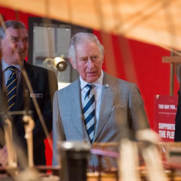 His Royal Highness The Prince of Wales with Admiral Sir Trevor Soar looking through the rigging at HMS Victory model.